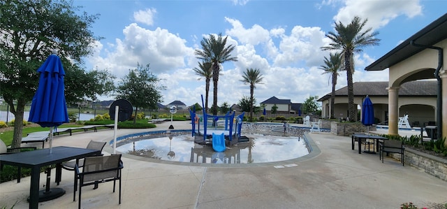 19210 Palfrey Prairie Trl, Tomball, TX 77377 - view of community with a patio and a pool