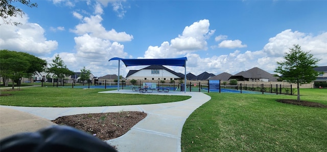 19210 Palfrey Prairie Trl, Tomball, TX 77377 - view of home's community featuring a lawn, fence, a tennis court, and a residential view