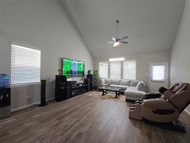 19210 Palfrey Prairie Trl, Tomball, TX 77377 - living room featuring high vaulted ceiling, baseboards, a ceiling fan, and dark wood-style flooring