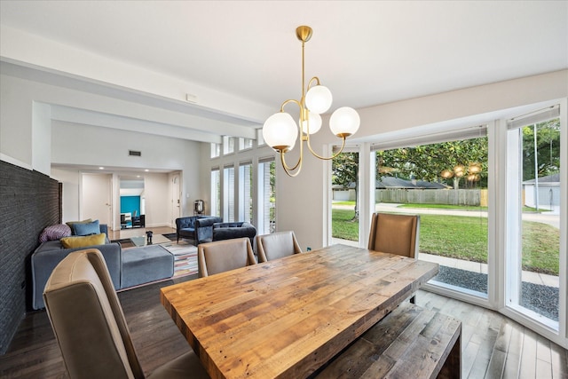 10134 Eddystone Dr, Houston, TX 77043 - dining room with a chandelier, wood finished floors, and a wealth of natural light