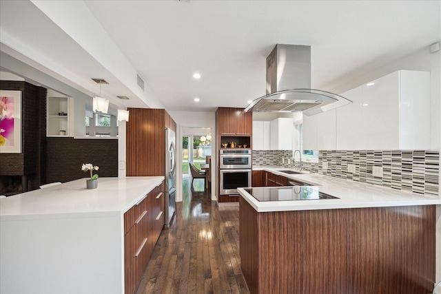 10134 Eddystone Dr, Houston, TX 77043 - kitchen with a sink, island exhaust hood, modern cabinets, a peninsula, and appliances with stainless steel finishes