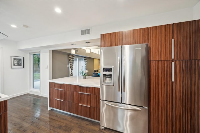 10134 Eddystone Dr, Houston, TX 77043 - kitchen with dark wood-type flooring, stainless steel fridge, and modern cabinets