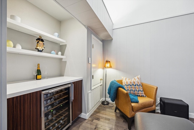 10134 Eddystone Dr, Houston, TX 77043 - bar featuring wood finished floors, beverage cooler, a bar, and visible vents
