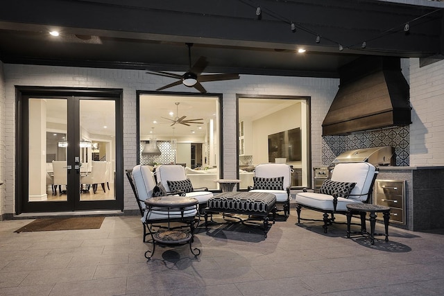 view of patio featuring grilling area, french doors, and ceiling fan