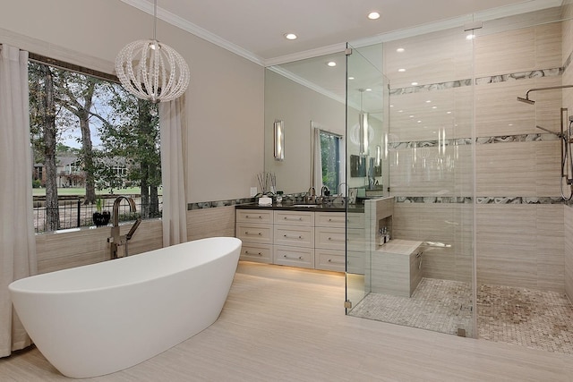 full bathroom with a freestanding bath, recessed lighting, a shower stall, crown molding, and vanity