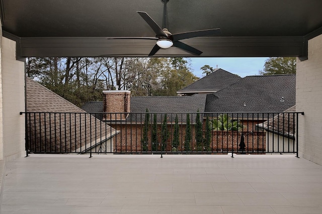 view of patio featuring a balcony and ceiling fan