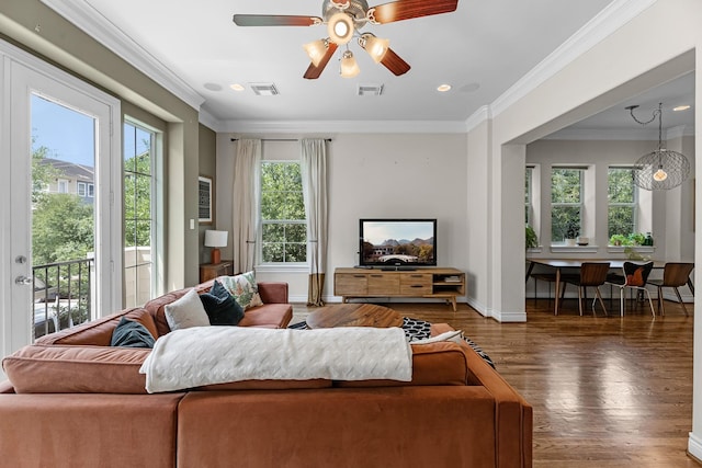 living area with ceiling fan, baseboards, wood finished floors, and visible vents