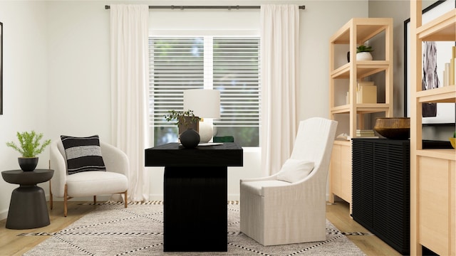 sitting room featuring wood finished floors