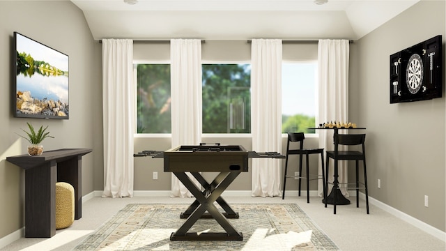 sitting room with vaulted ceiling, carpet flooring, and baseboards