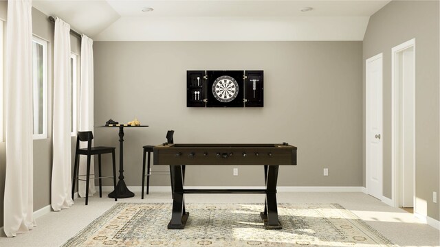 interior space with baseboards, lofted ceiling, and carpet flooring
