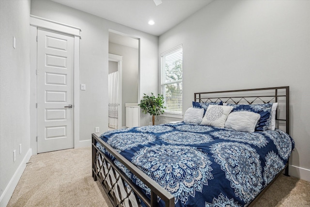 carpeted bedroom featuring recessed lighting and baseboards