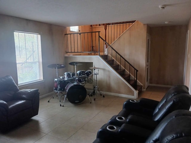 15907 Whispering Falls Ct, Houston, TX 77084 - tiled living area featuring baseboards and stairway