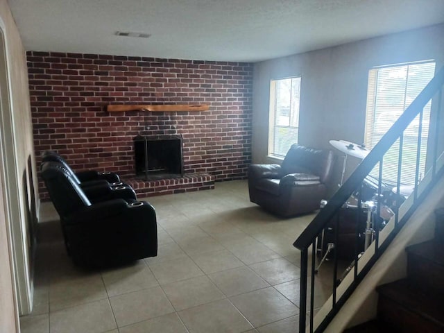 15907 Whispering Falls Ct, Houston, TX 77084 - tiled living area with a brick fireplace