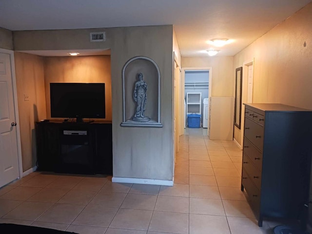 15907 Whispering Falls Ct, Houston, TX 77084 - hall with light tile patterned flooring and washer / dryer