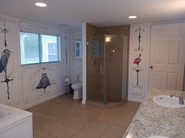 15907 Whispering Falls Ct, Houston, TX 77084 - bathroom with a stall shower, tile patterned floors, double vanity, toilet, and recessed lighting