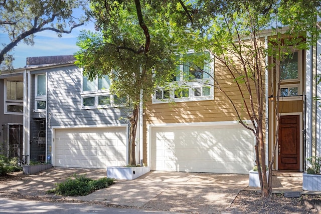 view of front facade with an attached garage and concrete driveway