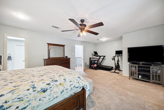 bedroom featuring baseboards, a ceiling fan, visible vents, and carpet