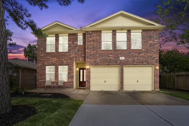 11947 Solon Springs Dr, Tomball, TX 77375 - view of front of property with brick siding, an attached garage, and driveway