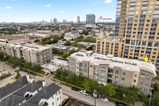 birds eye view of property featuring a city view
