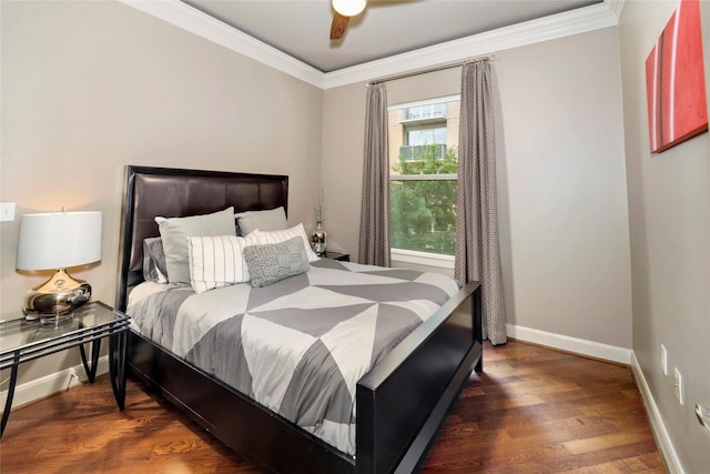 bedroom featuring a ceiling fan, baseboards, ornamental molding, and wood finished floors