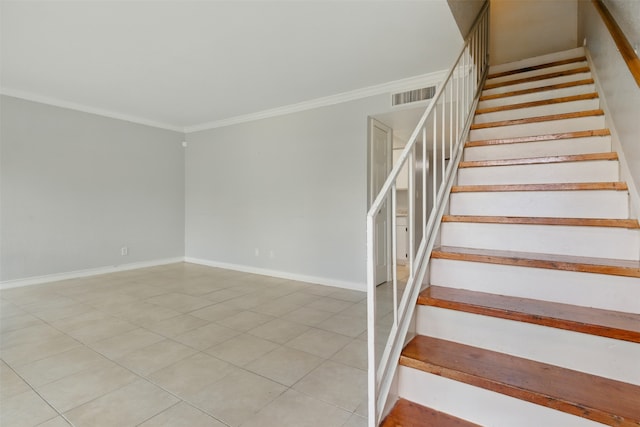 stairway with baseboards, visible vents, tile patterned flooring, and ornamental molding