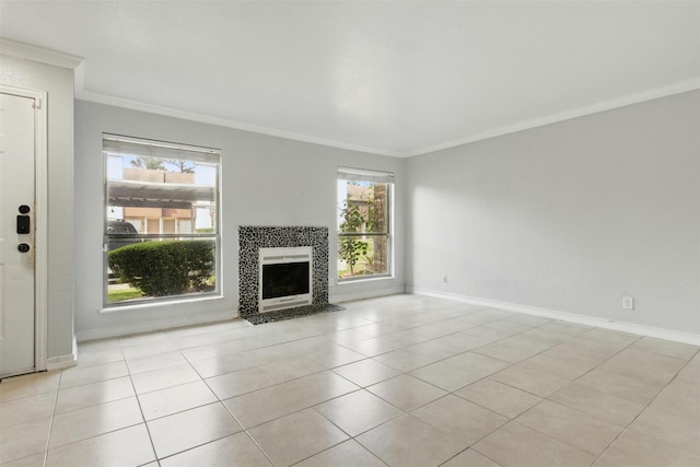 unfurnished living room featuring a wealth of natural light, crown molding, and baseboards
