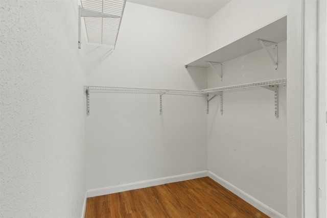 spacious closet with wood finished floors