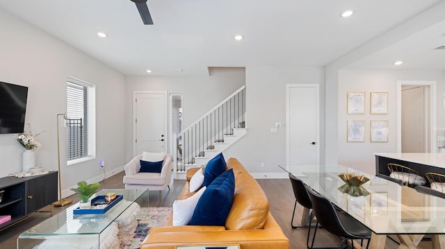 living room featuring recessed lighting, wood finished floors, stairs, baseboards, and a ceiling fan