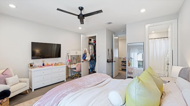 bedroom with visible vents, ceiling fan, carpet floors, recessed lighting, and a walk in closet