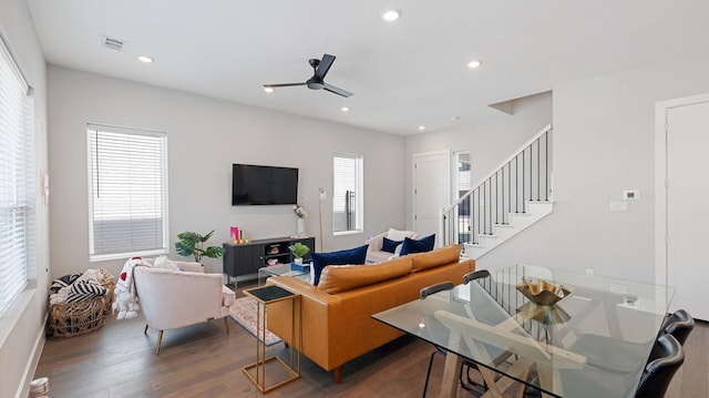 living area with recessed lighting, wood finished floors, stairway, ceiling fan, and visible vents