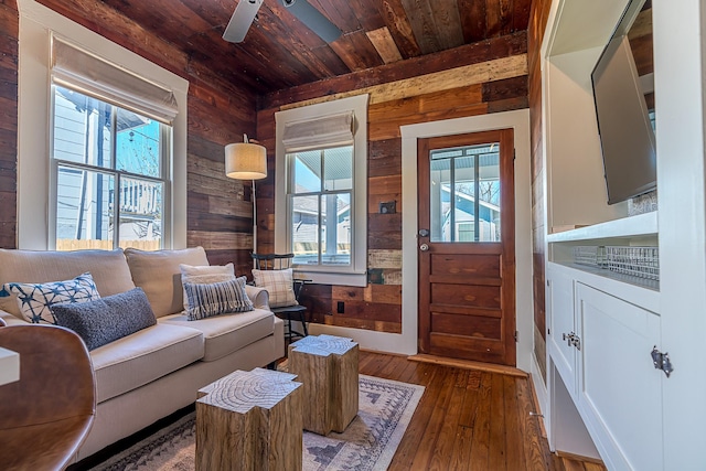 3825 Avenue N 1/2 Ave N Unit 1/2, Galveston, TX 77550 - living room featuring wood ceiling, wood walls, hardwood / wood-style floors, and plenty of natural light