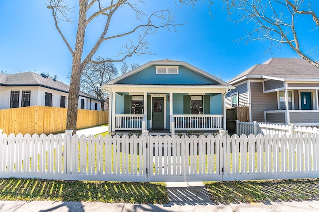 3825 Avenue N 1/2 Ave N Unit 1/2, Galveston, TX 77550 - bungalow featuring a porch and a fenced front yard