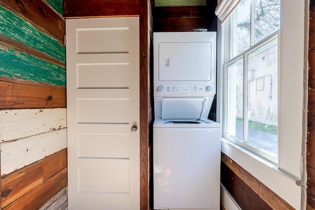 3825 Avenue N 1/2 Ave N Unit 1/2, Galveston, TX 77550 - laundry room with stacked washer / drying machine, wood walls, and laundry area