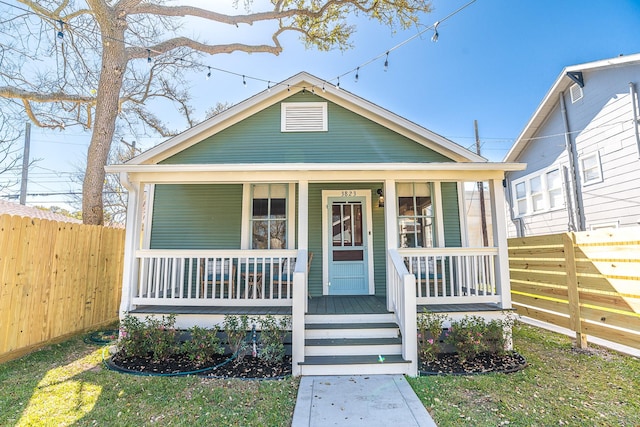 3825 Avenue N 1/2 Ave N Unit 1/2, Galveston, TX 77550 - bungalow-style home with fence and covered porch