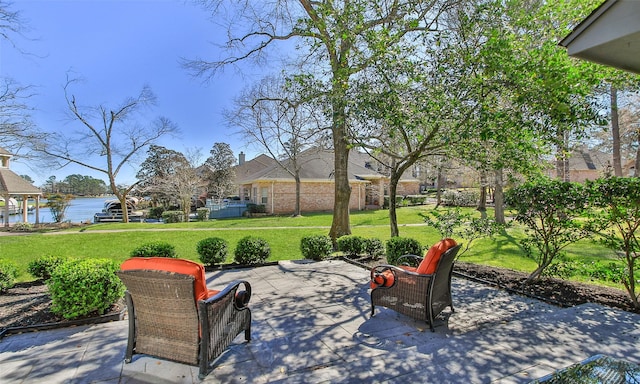 view of patio featuring a water view