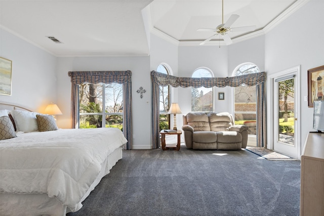 carpeted bedroom with ceiling fan, access to outside, a high ceiling, ornamental molding, and visible vents