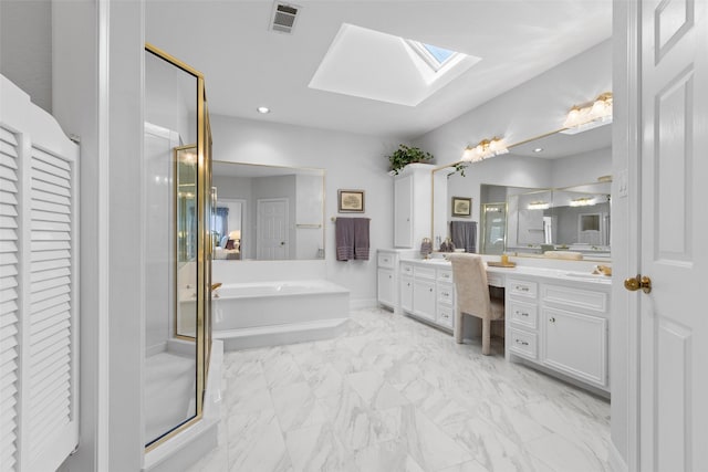 bathroom featuring a garden tub, a stall shower, a skylight, vanity, and visible vents