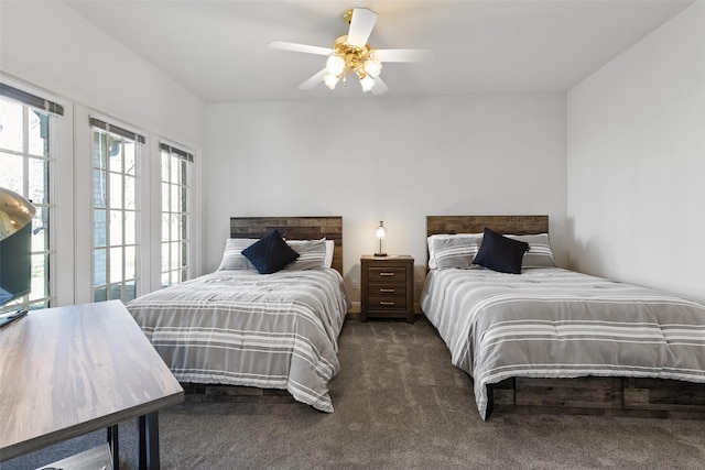 bedroom with ceiling fan and carpet flooring