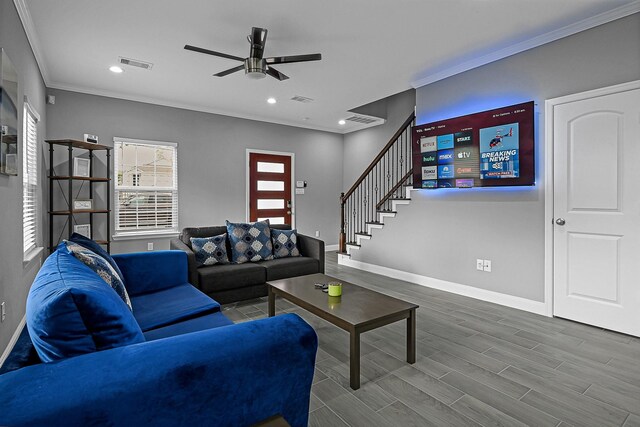 4903 Mallow St Unit Ab, Houston, TX 77033 - living area with baseboards, a ceiling fan, crown molding, and visible vents