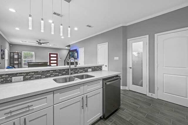 4903 Mallow St Unit Ab, Houston, TX 77033 - kitchen with stainless steel dishwasher, visible vents, a sink, and crown molding