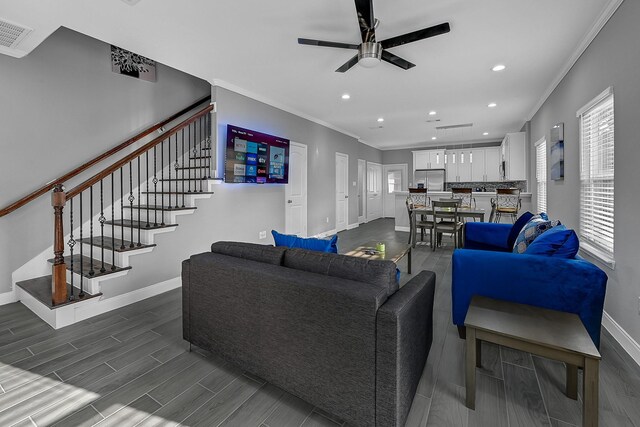 4903 Mallow St Unit Ab, Houston, TX 77033 - living room with recessed lighting, crown molding, baseboards, and ceiling fan
