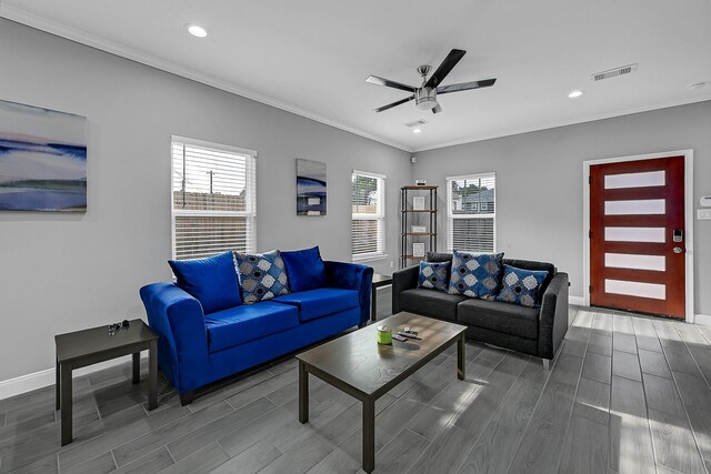 4903 Mallow St Unit Ab, Houston, TX 77033 - living area featuring ornamental molding, wood finish floors, a ceiling fan, and visible vents