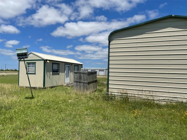 view of side of home with an outdoor structure