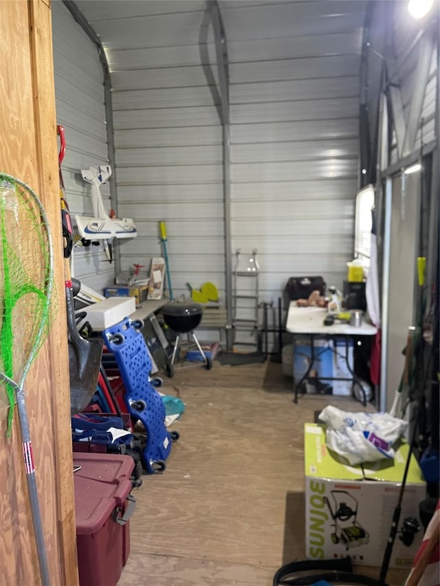 garage featuring wood walls