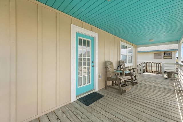 214 Sand Dune Ct, Surfside Beach, TX 77541 - wooden terrace featuring covered porch