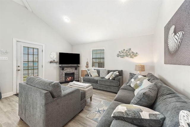 214 Sand Dune Ct, Surfside Beach, TX 77541 - living area featuring a fireplace, light wood-type flooring, and high vaulted ceiling