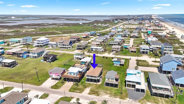 214 Sand Dune Ct, Surfside Beach, TX 77541 - drone / aerial view featuring a residential view and a water view