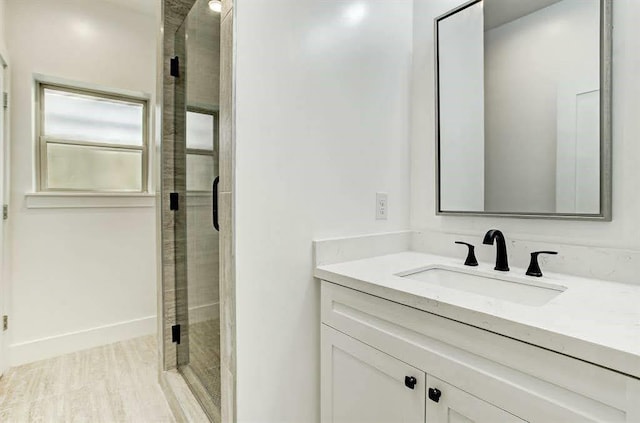 1217 Edwards St, Houston, TX 77007 - full bath featuring a shower stall, vanity, and wood finished floors