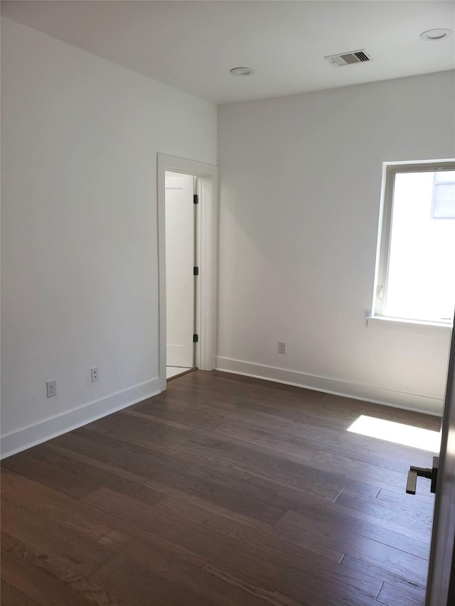 1217 Edwards St, Houston, TX 77007 - unfurnished room featuring dark wood-style flooring and baseboards