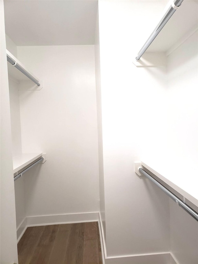 1217 Edwards St, Houston, TX 77007 - spacious closet featuring dark wood-type flooring